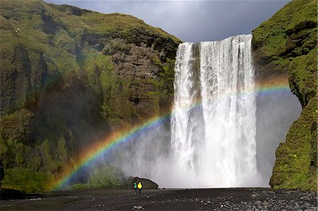 Skogafoss waterfall with rainbow in summer sunshine, South coast, Iceland, Polar Regions Foto de stock - Con derechos protegidos, Código: 841-06502648