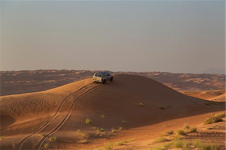 Four wheel drive on desert dunes, Wahiba, Oman, Middle East Photographie de stock - Rights-Managed, Code: 841-06616604