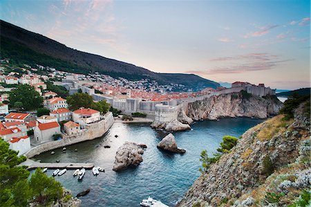 sunrise over water - Dubrovnik Old Town and the City Walls at sunrise, from Fort Lovrijenac (St. Lawrence Fort), Dubrovnik, Dalmatian Coast, Adriatic, Croatia, Europe Stock Photo - Rights-Managed, Code: 841-06804671