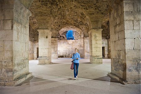 Tourist exploring the underground halls at Diocletian's Palace, UNESCO World Heritage Site, Split, Dalmatian Coast, Croatia, Europe Stock Photo - Rights-Managed, Code: 841-06804781