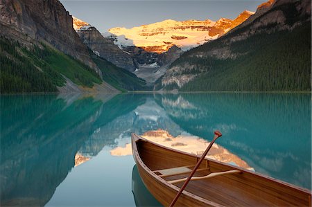 photo of empty canoe on water - Canoe on Lake Louise at sunrise, Banff National Park, UNESCO World Heritage Site, Alberta, Rocky Mountains, Canada, North America Stock Photo - Rights-Managed, Code: 841-06805517