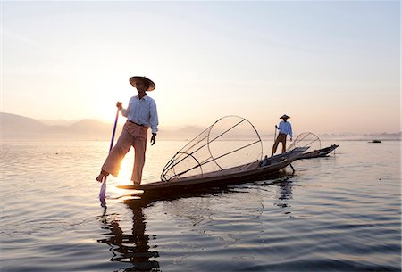 shan state - Intha leg rowing fishermen at dawn on Inle Lake who row traditional wooden boats using their leg and fish using nets stretched over conical bamboo frames, Inle Lake, Shan State, Myanmar (Burma), Asia Stock Photo - Rights-Managed, Code: 841-06805749