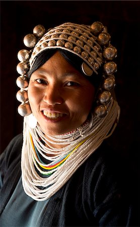 Woman of the Akha tribe in traditional dress including a headdress of heavy silver baubles, in a hill village near Kengtung (Kyaingtong), Shan State, Myanmar (Burma), Asia Stock Photo - Rights-Managed, Code: 841-06805760