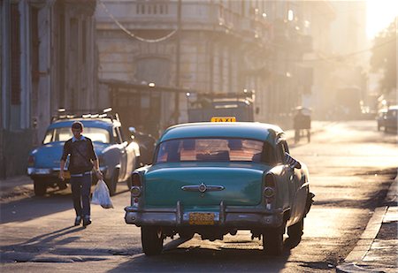 simsearch:841-03672982,k - Vintage American car taxi on Avenue Colon during morning rush hour soon after sunrise, Havana Centro, Cuba, West Indies, Central America Stock Photo - Rights-Managed, Code: 841-06805781