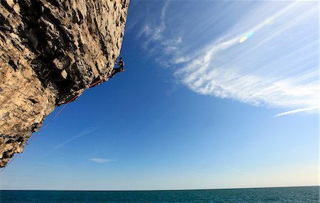 simsearch:841-03675371,k - A climber scales cliffs near Swanage, Dorset, England, United Kingdom, Europe Fotografie stock - Rights-Managed, Codice: 841-06806922