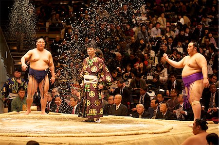 sumo wrestler - Some sumo fighters throwing salt before a fight at the Kokugikan stadium, Tokyo, Japan, Asia Stock Photo - Rights-Managed, Code: 841-06807085