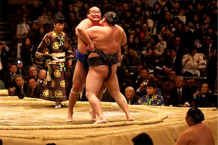 sport fight - Two sumo wrestlers pushing hard to put their opponent out of the circle, sumo wrestling competition, Tokyo, Japan, Asia Stock Photo - Rights-Managed, Code: 841-06807090