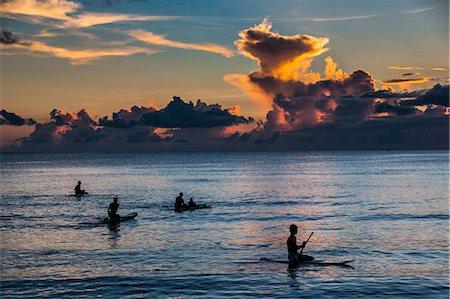 paddling on surf board - Surfer at sunset in Guam, US Territory, Central Pacific, Pacific Stock Photo - Rights-Managed, Code: 841-06807237