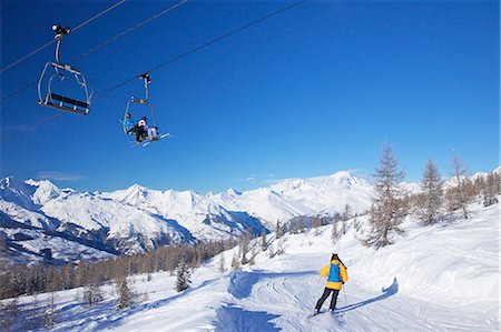 pictures of winter in europe - Vallandry chairlift with La Foret blue piste and Mont Blanc behind, Peisey-Vallandry, Les Arcs, Savoie, French Alps, France, Europe Stock Photo - Rights-Managed, Code: 841-06807530