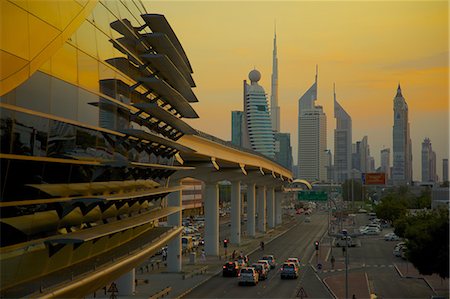 futuristic - City skyline and Metro Station at sunset, Dubai, United Arab Emirates, Middle East Stock Photo - Rights-Managed, Code: 841-06807666