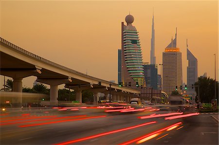 dubai, skyline - City skyline and car trail lights at sunset, Dubai, United Arab Emirates, Middle East Stock Photo - Rights-Managed, Code: 841-06807661