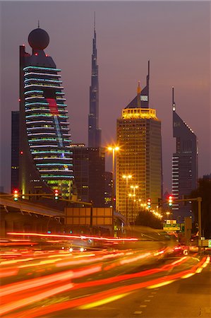 dubai, skyline - City skyline and car trail lights at sunset, Dubai, United Arab Emirates, Middle East Stock Photo - Rights-Managed, Code: 841-06807662