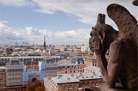 simsearch:841-07783181,k - A gargoyle stares out from Notre Dame de Paris cathedral, Paris, France, Europe Fotografie stock - Rights-Managed, Codice: 841-06807808