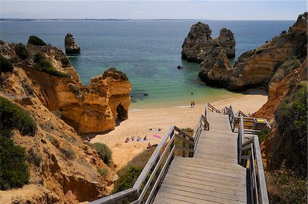 Wooden steps down to Praia do Camilo (Camel beach), Lagos, Algarve, Portugal, Europe Fotografie stock - Rights-Managed, Codice: 841-06808121