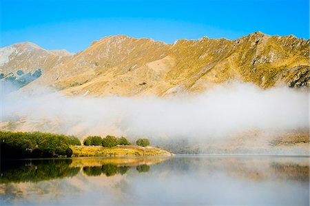 Misty dawn reflections at Lake Moke, Queenstown, Otago, South Island, New Zealand, Pacific Stockbilder - Lizenzpflichtiges, Bildnummer: 841-07080535