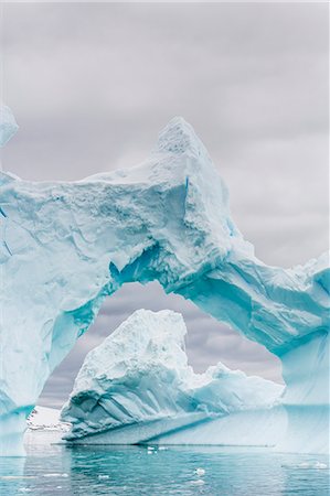 Huge arched iceberg near Petermann Island, western side of the Antarctic Peninsula, Southern Ocean, Polar Regions Stock Photo - Rights-Managed, Code: 841-07080940