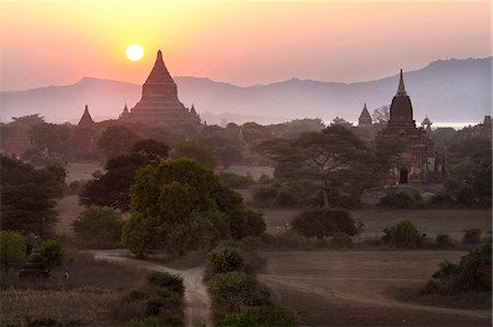 red orange sunset - View over the temples of Bagan at sunset, from Shwesandaw Paya, Bagan, Myanmar (Burma), Southeast Asia Stock Photo - Rights-Managed, Code: 841-07081604