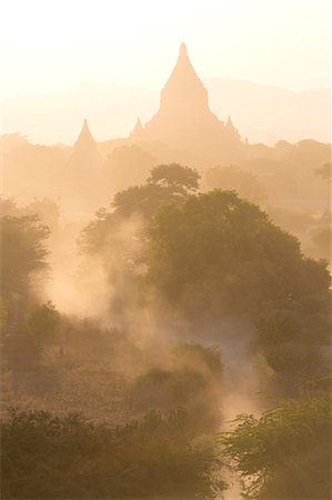 View over the temples of Bagan swathed in dust and evening sunlight, from Shwesandaw Paya, Bagan, Myanmar (Burma), Southeast Asia Stock Photo - Rights-Managed, Code: 841-07081603