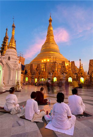 Shwedagon Paya (Pagoda) at dusk with Buddhist worshippers praying, Yangon (Rangoon), Myanmar (Burma), Asia Stock Photo - Rights-Managed, Code: 841-07081679