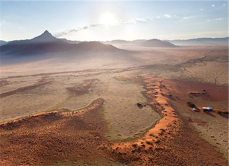 simsearch:841-07081790,k - Aerial view from hot air balloon at dawn over magnificent desert landscape of sand dunes, mountains and Fairy Circles, Namib Rand game reserve Namib Naukluft Park, Namibia, Africa Photographie de stock - Rights-Managed, Code: 841-07081736