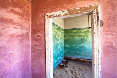 Interior of building slowly being consumed by the sands of the Namib Desert in the abandoned former German diamond mining town of Kolmanskop, Forbidden Diamond Area near Luderitz, Namibia, Africa Stock Photo - Rights-Managed, Code: 841-07081758