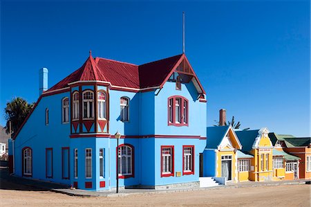 street color buildings - Colourful houses of Germanic design in the coastal town of Luderitz, Namibia, Africa Photographie de stock - Rights-Managed, Code: 841-07081766