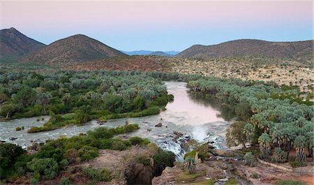 Epupa Falls on the Kunene River (which forms the border between Namibia and Angola), Kunene Region (formerly Kaokoland), Namibia, Africa Stock Photo - Rights-Managed, Code: 841-07081789