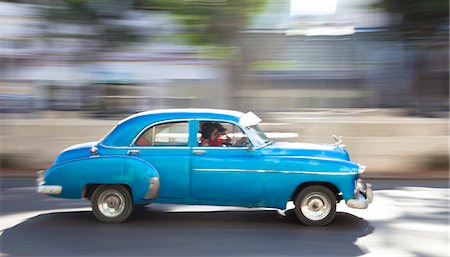 Panned' shot of old American car to capture sense of movement, Prado, Havana Centro, Cuba, West Indies, Central America Stock Photo - Rights-Managed, Code: 841-07081798