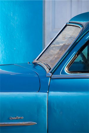 Detail of vintage blue American car against painted blue wall, Cienfuegos, Cuba, West Indies, Central America Stock Photo - Rights-Managed, Code: 841-07081826