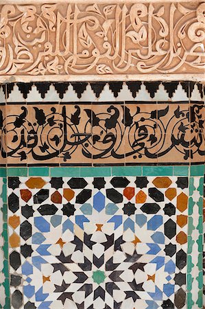 Detail of calligraphy and zellij in the patio, Ben Youssef Meders, the largest Medersa in Morocco, originally a religious school founded under Abou el Hassan, UNESCO World Heritage Site, Marrakech, Morocco, North Africa Stock Photo - Rights-Managed, Code: 841-07083297