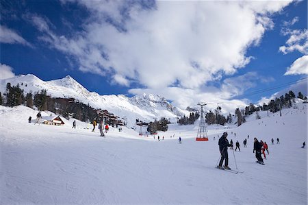 simsearch:841-09077101,k - Skiers on piste at Belle Plagne, La Plagne, Savoie, French Alps, France, Europe Stock Photo - Rights-Managed, Code: 841-07083830