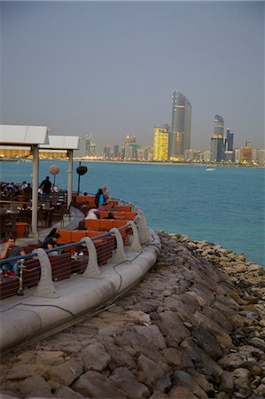 simsearch:841-02945718,k - View of city from Marina Cafe at dusk, Abu Dhabi, United Arab Emirates, Middle East Stock Photo - Rights-Managed, Code: 841-07083951