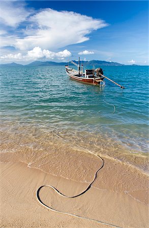 Traditional long-tailed fishing boat moored off Maenam Beach on the North Coast of Koh Samui, Thailand, Southeast Asia, Asia Stock Photo - Rights-Managed, Code: 841-07205172