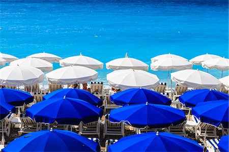 Beach parasols, Nice, Alpes Maritimes, Provence, Cote d'Azur, French Riviera, France, Europe Fotografie stock - Rights-Managed, Codice: 841-07205922