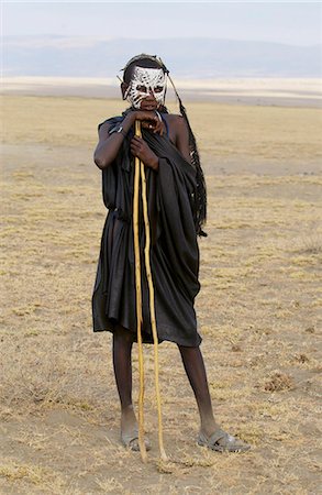 simsearch:841-02924082,k - Young Masai recently cirumsised wears white make-up markings and black robes until in a few weeks he adopts the full red colourful robes of a Masai Warrior Stock Photo - Rights-Managed, Code: 841-07201644