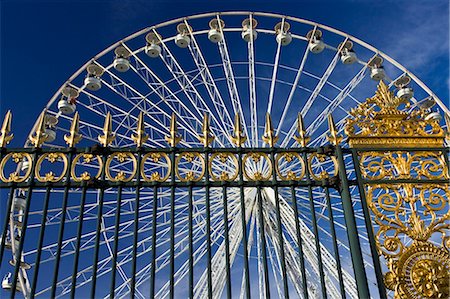spinning wheel theme park ride - Place de la Concorde ferris wheel, La Grande Roue, seen through railings of Les Jardin de Tuileries, Paris, France Stock Photo - Rights-Managed, Code: 841-07201802