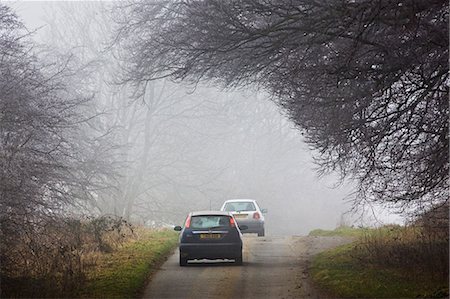 Cars drive along foggy road, Oxfordshire,  United Kingdom Stock Photo - Rights-Managed, Code: 841-07201884