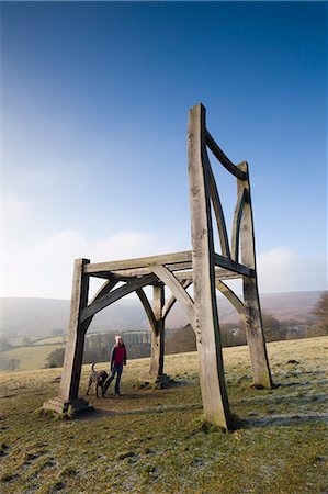 scale (contrast in size) - Dog walker gazes up at the Giants Chair sculpture in Dartmoor National Park, Devon, England, United Kingdom, Europe Stock Photo - Rights-Managed, Code: 841-07202268