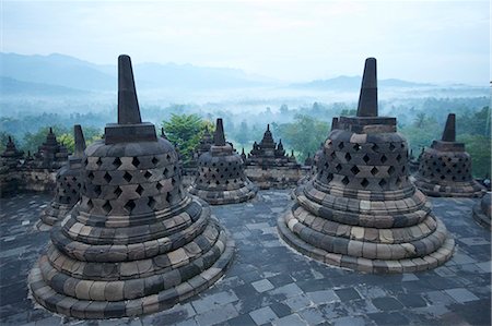 View over early morning monsoon mist lying across countryside, Borobudur Buddhist Temple, UNESCO World Heritage Site, Java, Indonesia, Southeast Asia, Asia Stock Photo - Rights-Managed, Code: 841-07202304