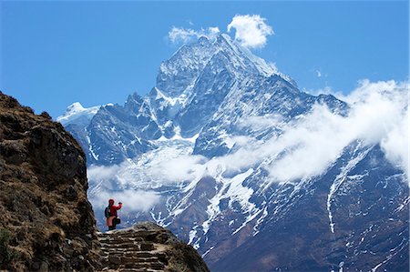 standing on the cliff - Trail between Namche Bazaar and Everest View Hotel, with Mt. Thamserku behind, Sagarmatha National Park, UNESCO World Heritage Site, Nepal, Himalayas, Asia Stock Photo - Rights-Managed, Code: 841-07202416