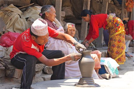 simsearch:841-07202444,k - Potter turning pot on wheel, Potter's Square, Bhaktapur, Nepal, Asia Stock Photo - Rights-Managed, Code: 841-07202443