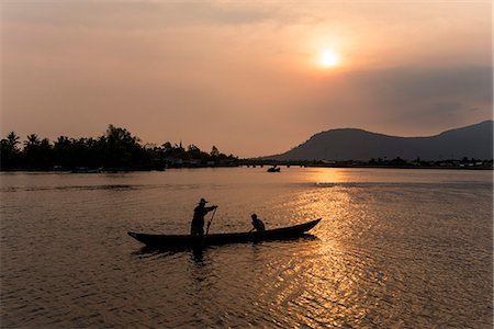 Father and son fishing on Kampong Bay River at sunset, Kampot, Cambodia, Indochina, Southeast Asia, Asia Stock Photo - Rights-Managed, Code: 841-07202638