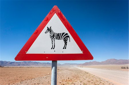 simsearch:841-07782322,k - Zebra crossing animal warning sign, Namib Desert, Namibia, Africa Photographie de stock - Rights-Managed, Code: 841-07355040