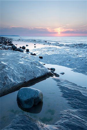 Sunset over the rocky shores of Kilve Beach, Somerset, England, United Kingdom, Europe Stock Photo - Rights-Managed, Code: 841-07355192