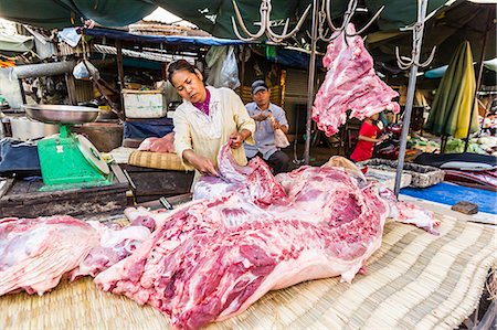 Fresh pork being prepared at street market in the capital city of Phnom Penh, Cambodia, Indochina, Southeast Asia, Asia Fotografie stock - Rights-Managed, Codice: 841-07457083