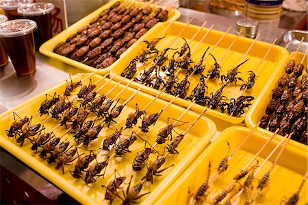 food stall - Deep fried grasshoppers, silkworms and scorpions for sale in the Night Market, Wangfujing Street, Beijing, China Stock Photo - Rights-Managed, Code: 841-07457244