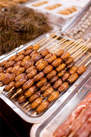 simsearch:841-07457265,k - Deep fried silkworm skewers for sale in the Night Market, Wangfujing Street, Beijing, China Stock Photo - Rights-Managed, Code: 841-07457243