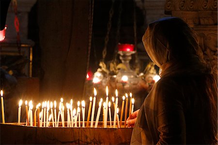 Pilgrim lighting candles in the Holy Sepulchre Church, Jerusalem, Israel, Middle East Stock Photo - Rights-Managed, Code: 841-07457591