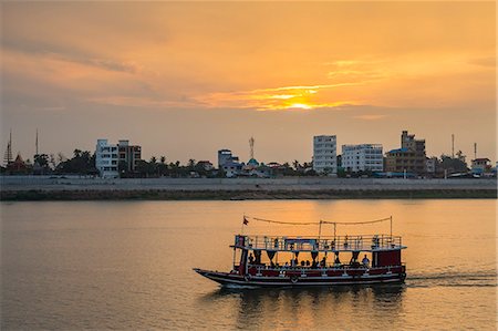 phnom penh - Sunset along the Mekong River in the capital city of Phnom Penh, Cambodia, Indochina, Southeast Asia, Asia Stock Photo - Rights-Managed, Code: 841-07523331
