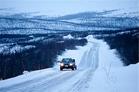 european autobahn - Car with trailer towing a snowmobile travels through arctic wilderness at nightfall by Kilpisjarvi on route from Norway into Finland Stock Photo - Rights-Managed, Code: 841-07523683